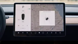 Tesla touchscreen displaying a prompt to tap the key card to drive